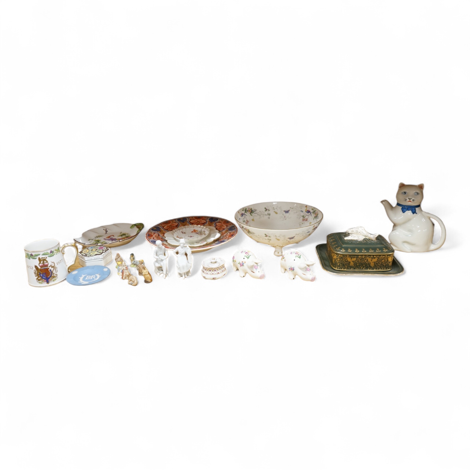 A collection of porcelain and pottery to include commemorative china, a leaf dish and group of wade figures, largest 29cm in diameter